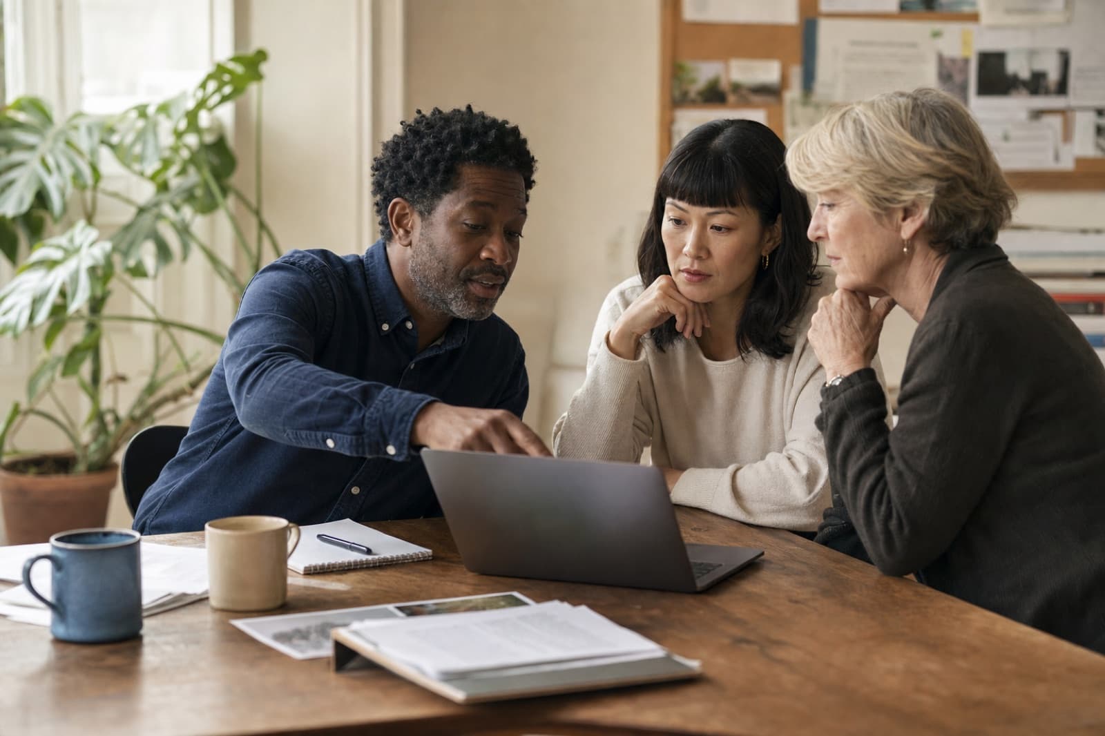 Three nonprofit colleagues reviewing a coalition letter together